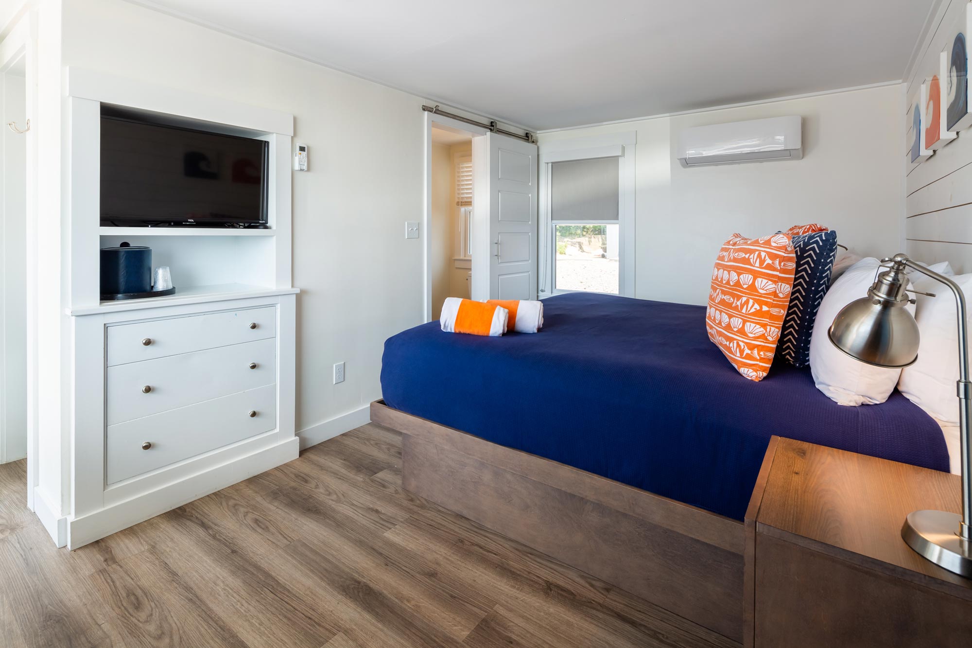 Hotel room with one bed and television
