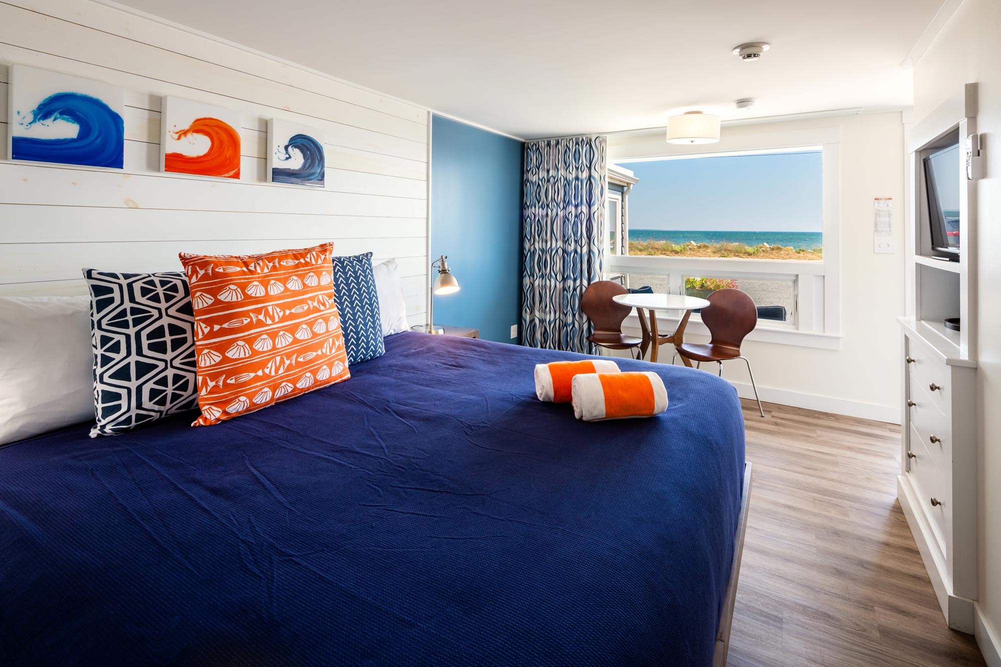 Hotel room with one bed , small table and chairs
