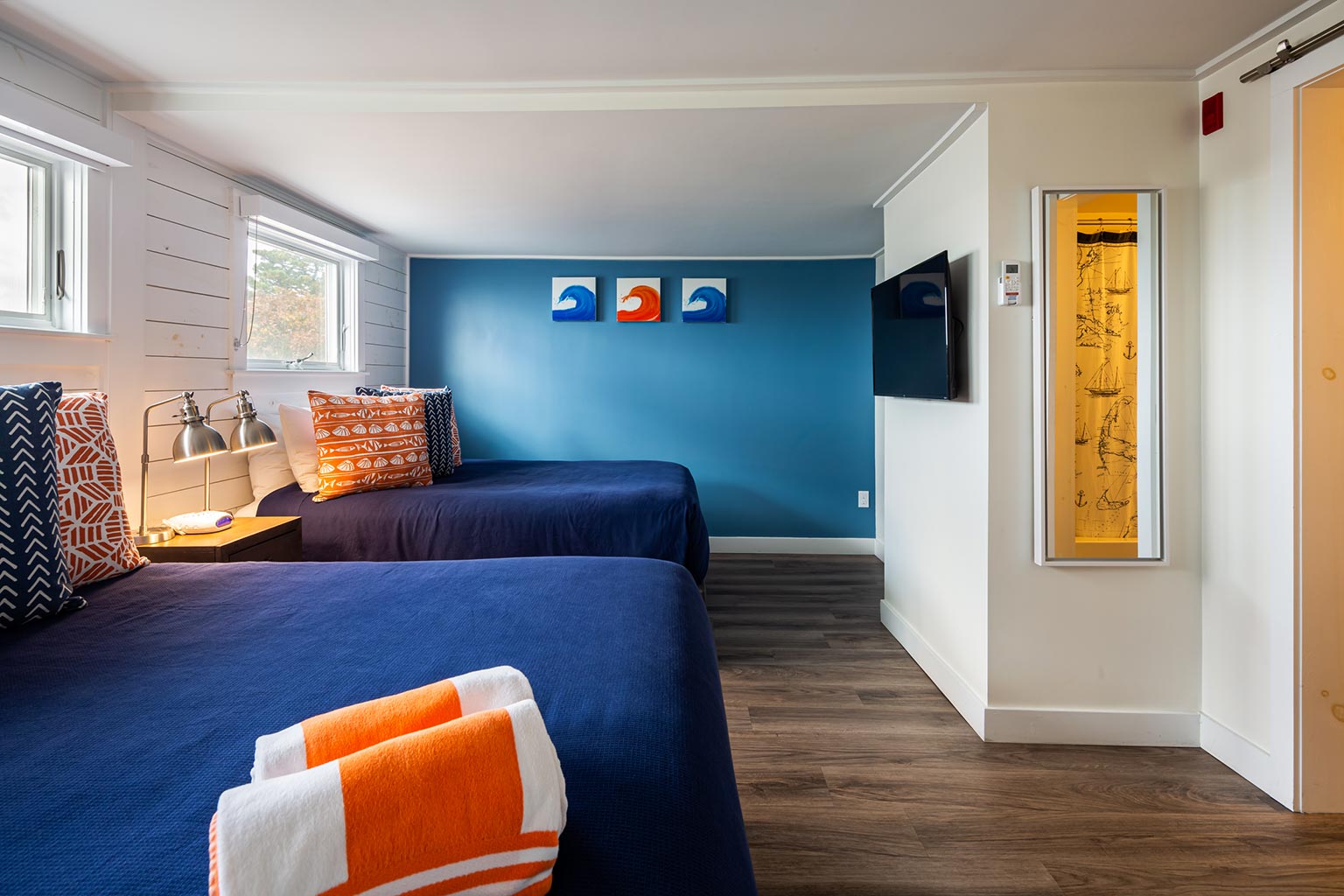 Hotel suite with two queen beds.