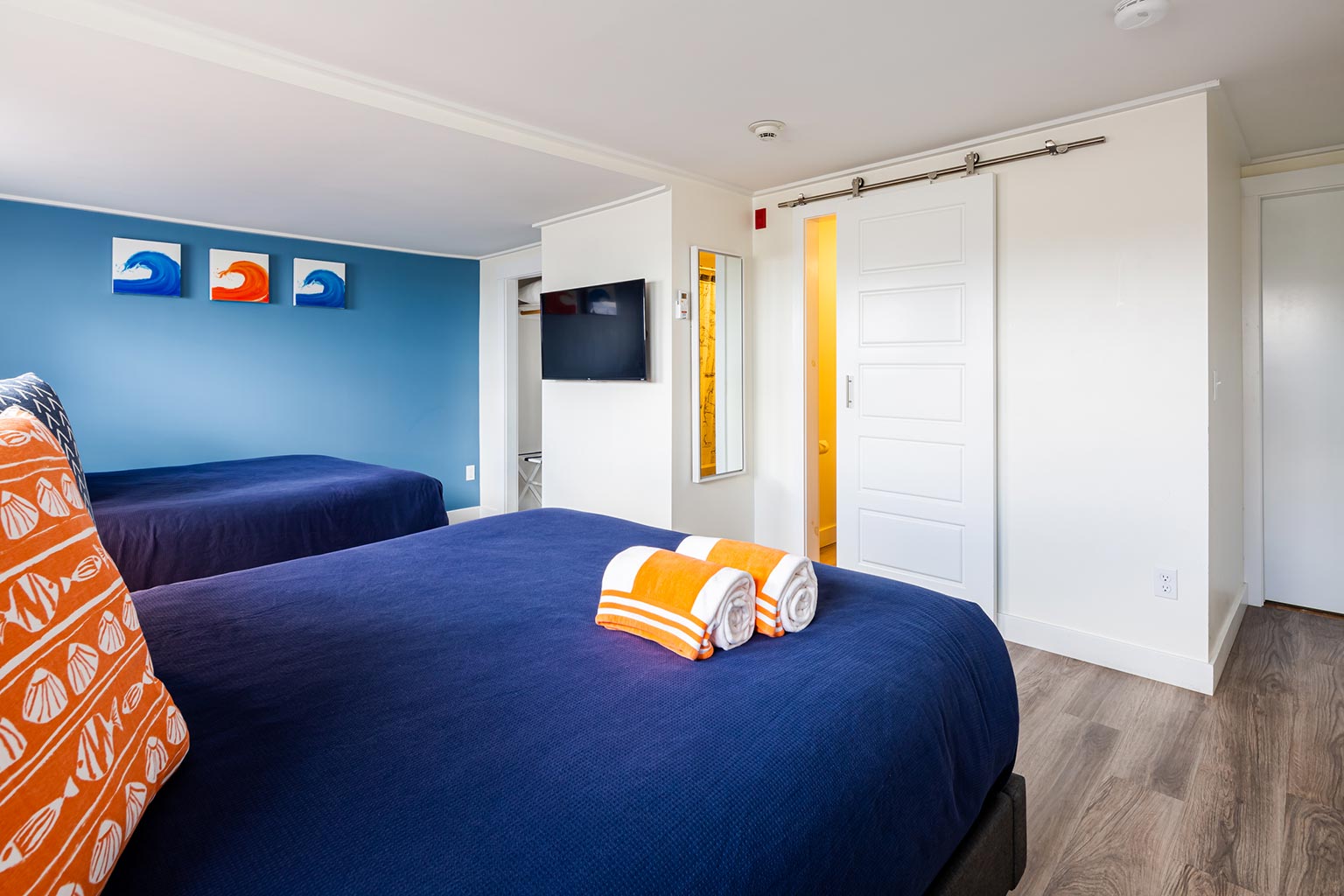 Breakwater Hotel with two queen beds in the foreground.