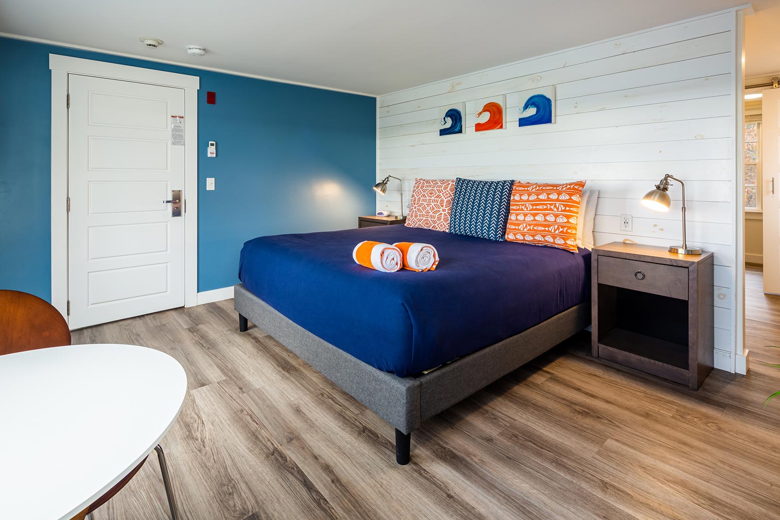 Breakwater hotel suite with king bed.